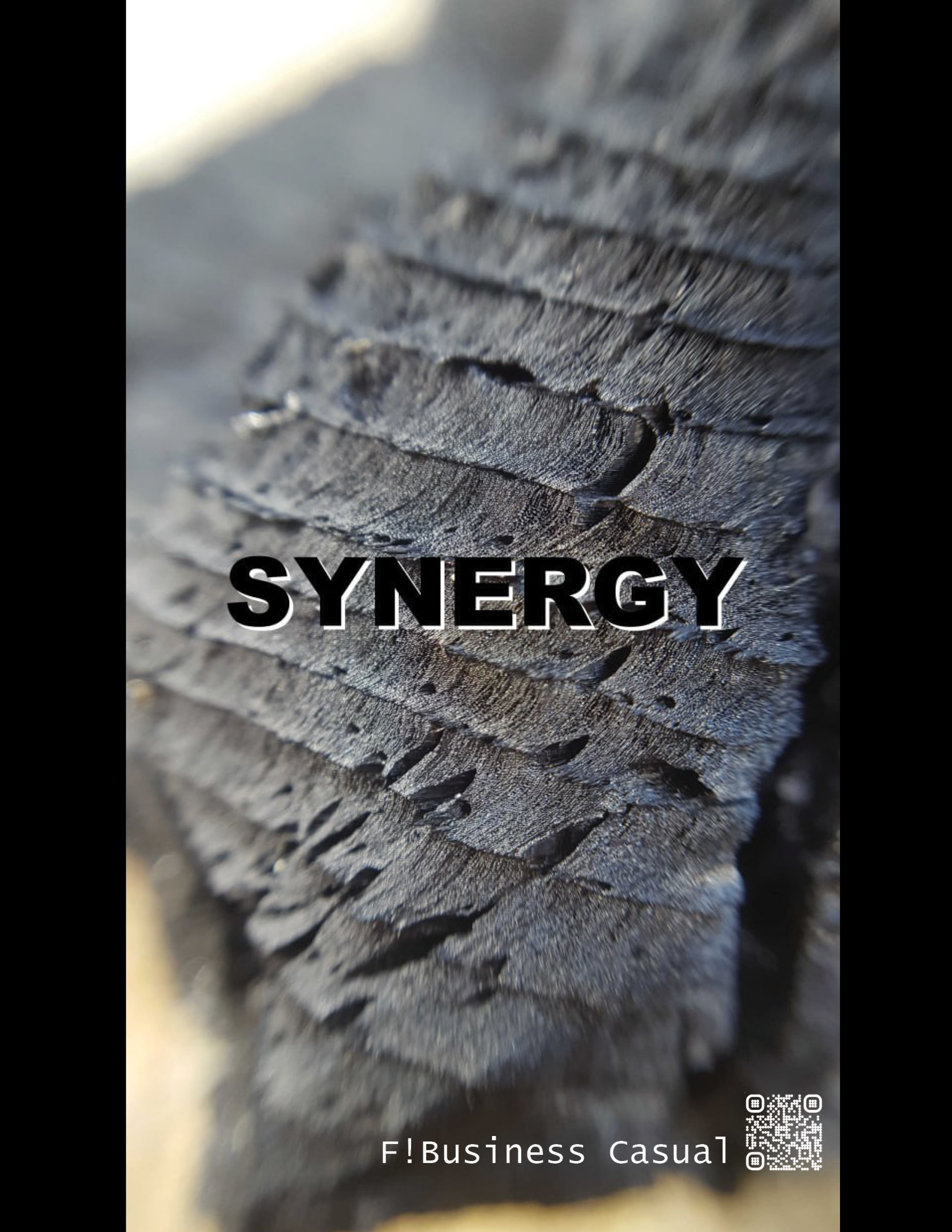 A close up of some charcoal with the word "synergy" pasted on top of it