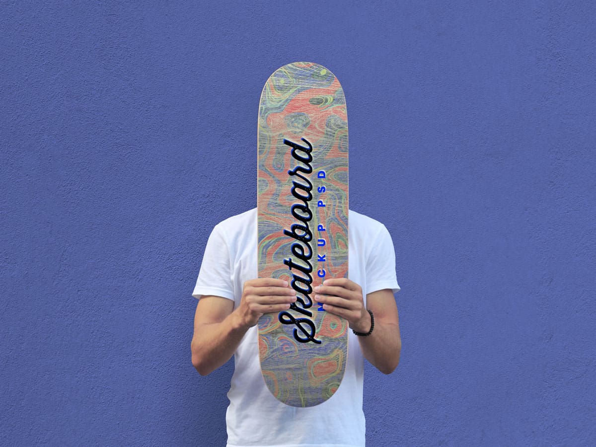 Asset | Free Man Holding Skateboard Mockup PSD | Designbolts