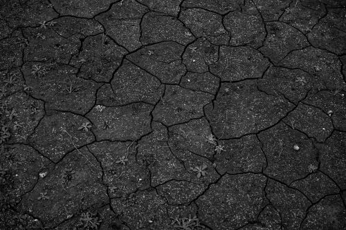 Texture | Black cracked concrete sand desert