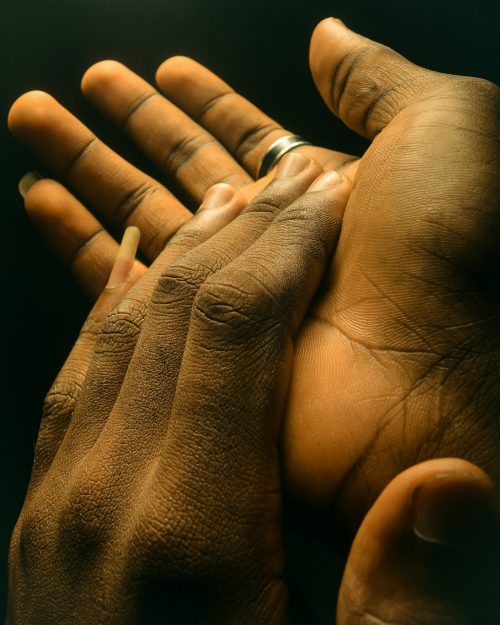 different kind of handshake -Close up Photography of black and brown hands