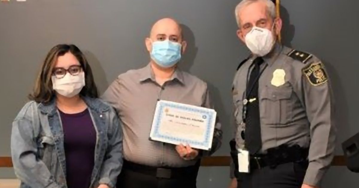 Christopher Palacios and wife with Alexandria Chief Michael Brown