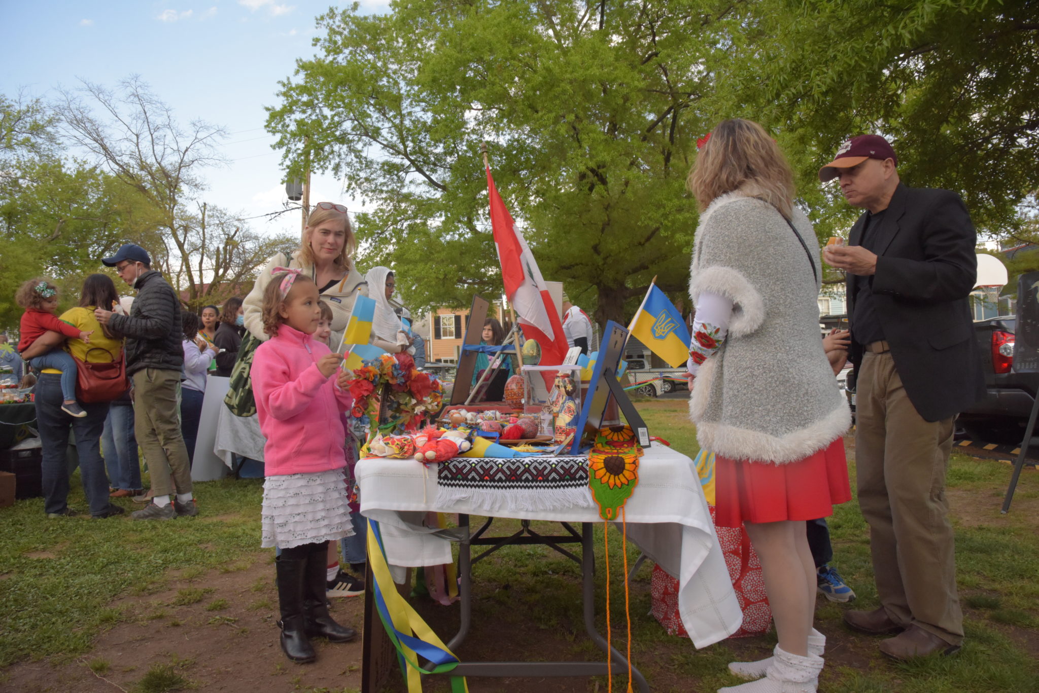 a girl holds a Ukrainian flag