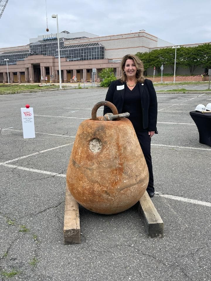 Vice Mayor of Alexandria Stands next to wrecking ball at landmark mall