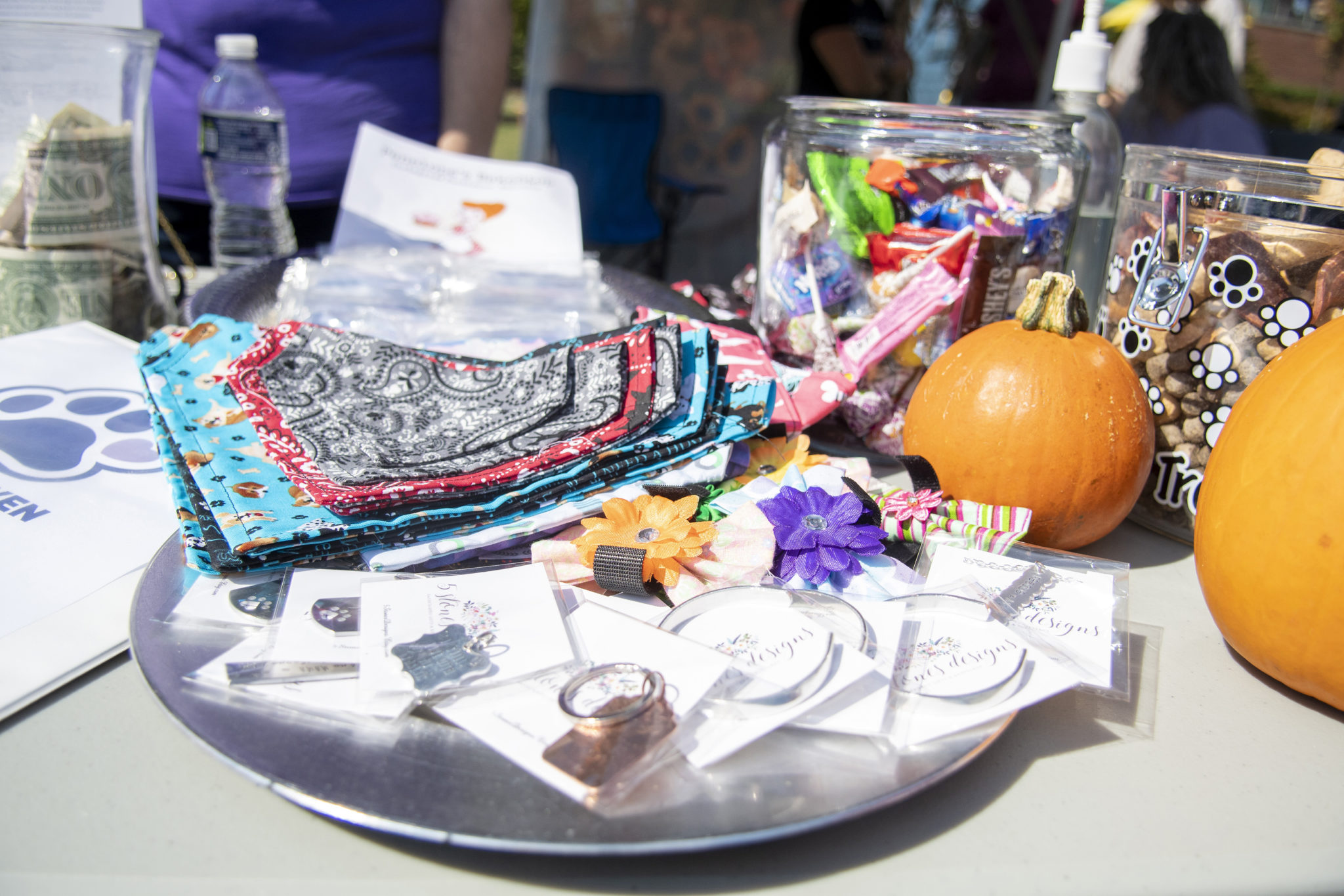 a tray with trinkets of jewelry, rings, necklaces, bandanas 