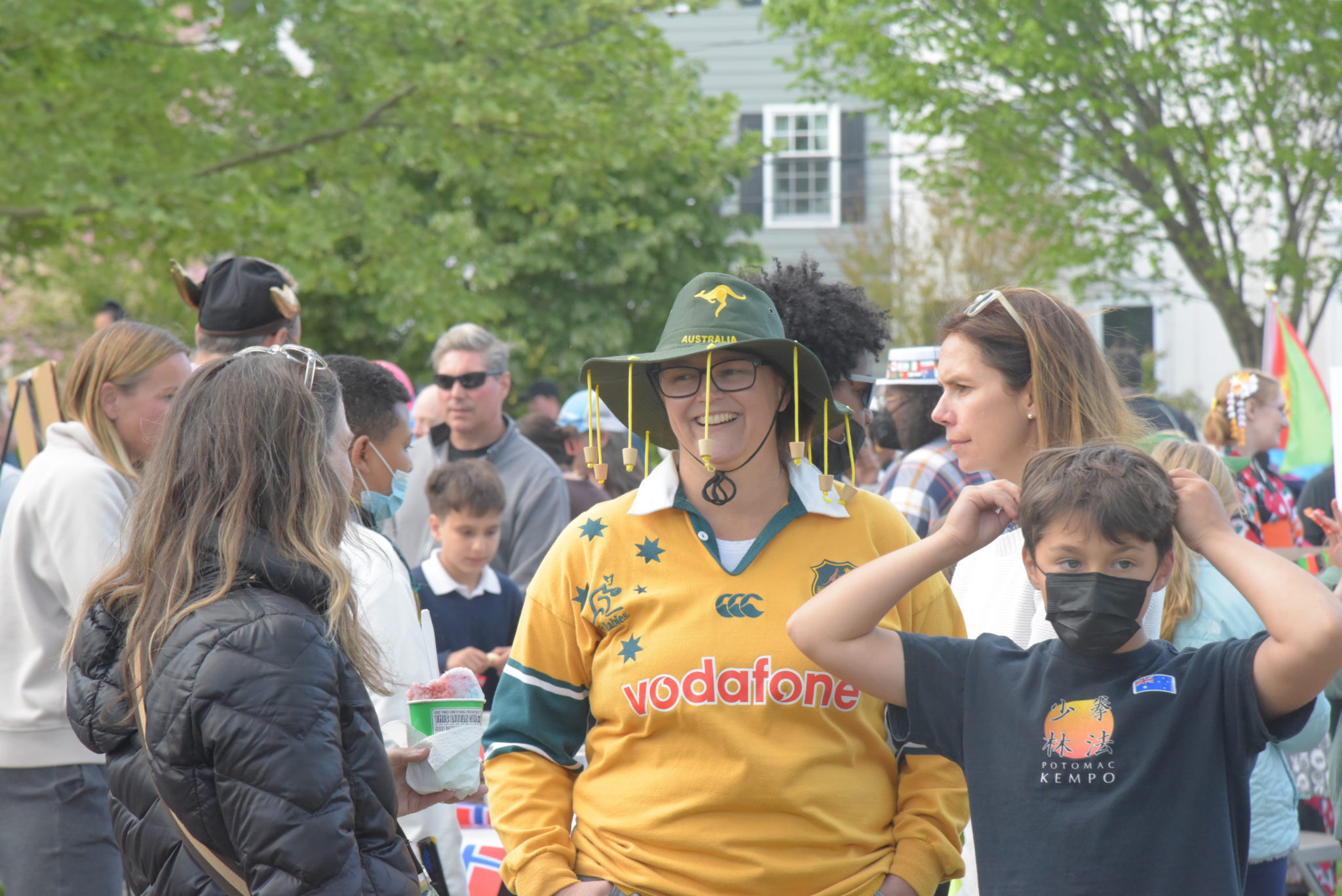 A woman in a green hat with a kangaroo on it