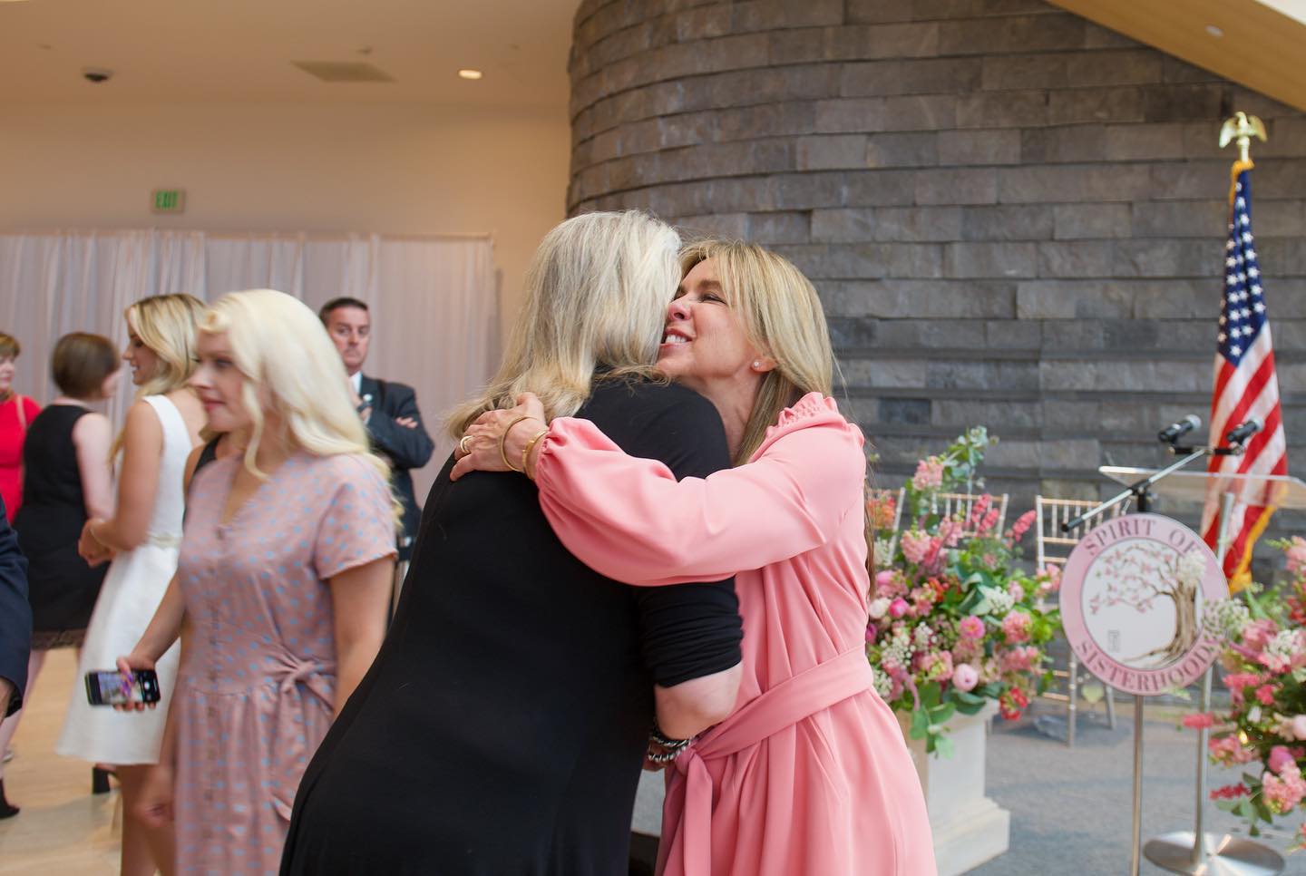 first lady young kin hugs a woman at her spirit of sisterhood in roanoke