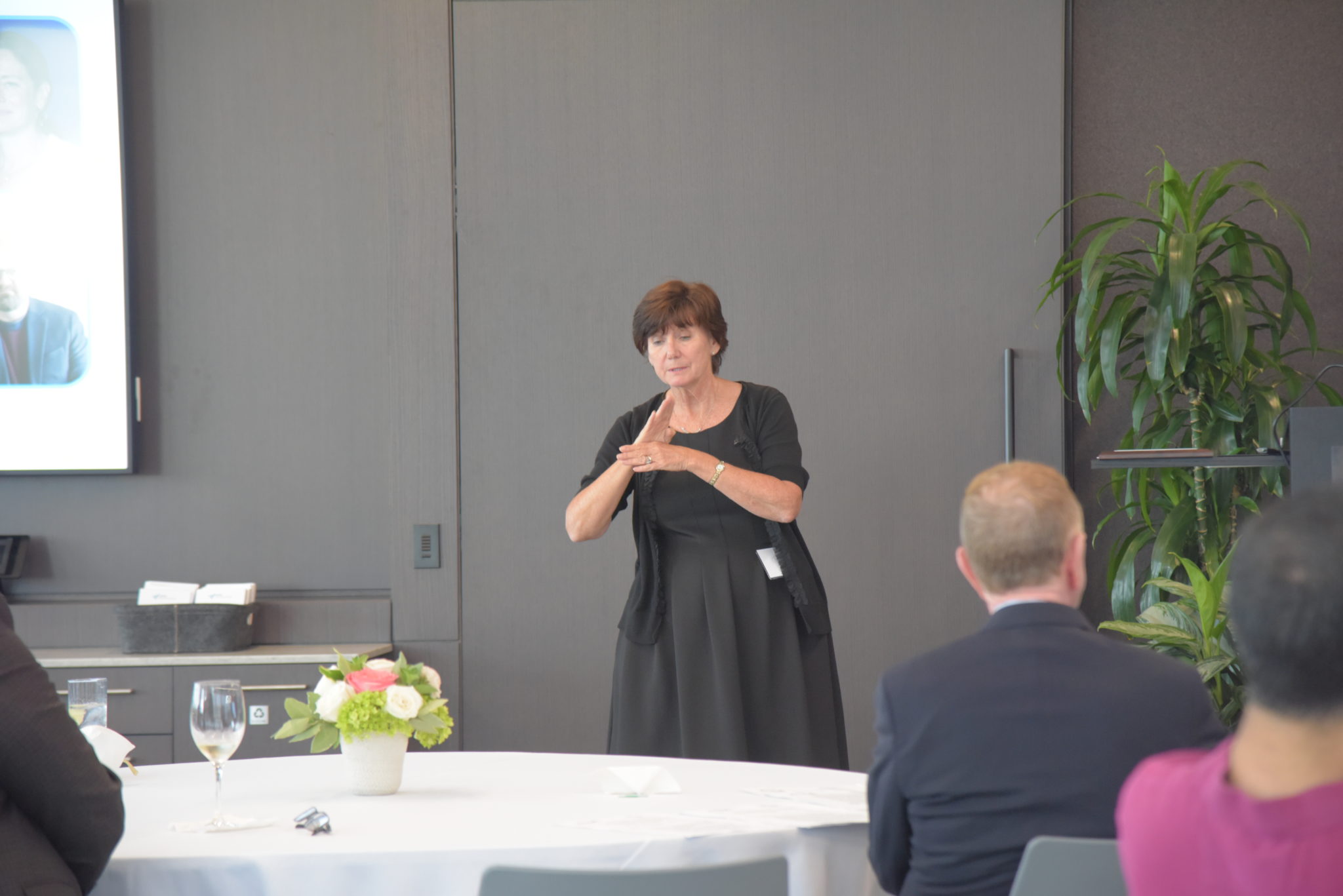 a sign language interpreter signs a speech at the disability awards