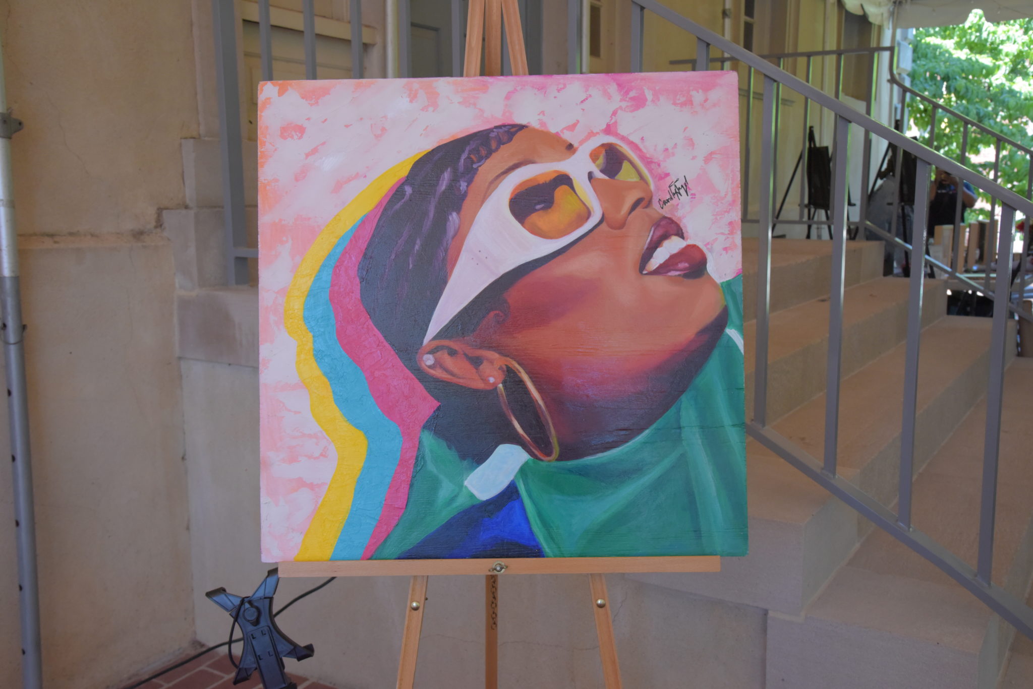 a canvas portrait of a black woman in sunglasses in multi chromatic shade