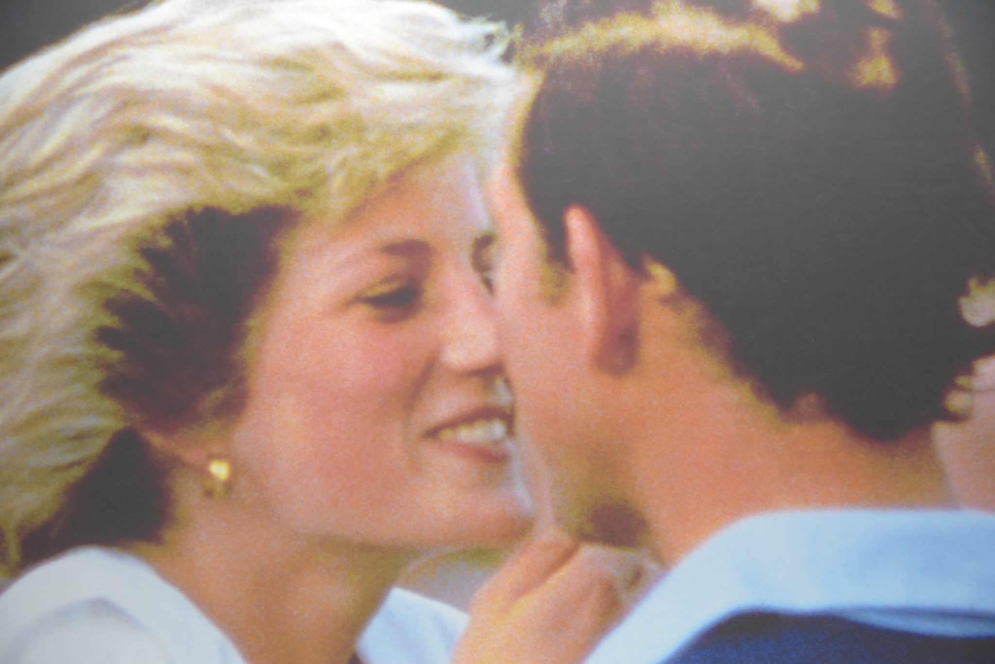 princess diana smiles at Prince charles as they share a kiss