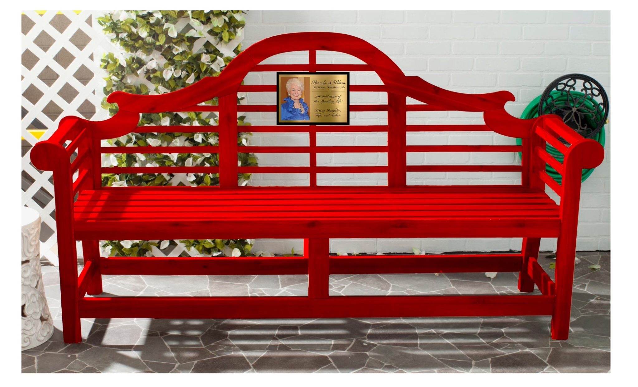 a red bench with a memorial photo and inscription to a woman, Brenda Wilson