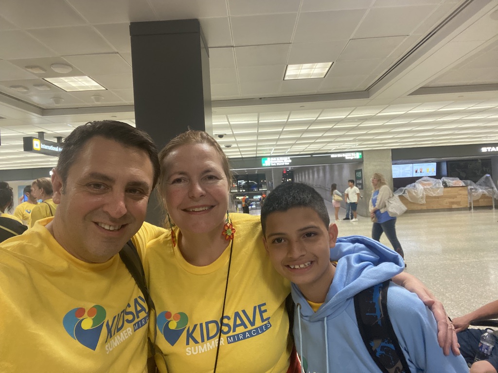 A Columbian boy meets two American parents to host him at Dulles Airport