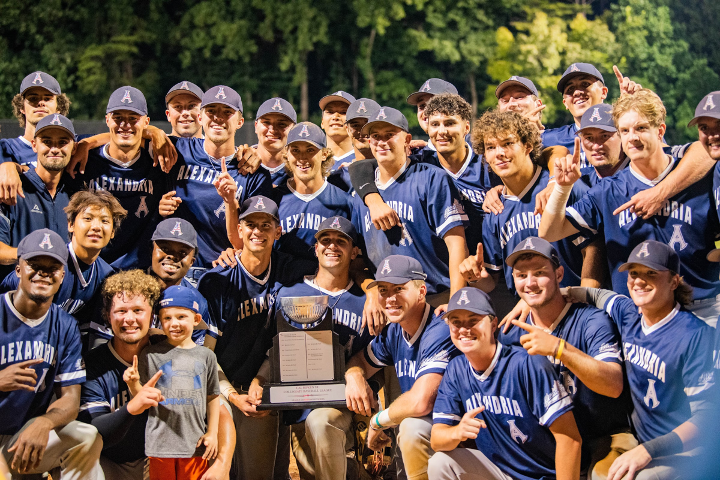 Alexandria Aces gather in front of their first place cal ripken league trophy