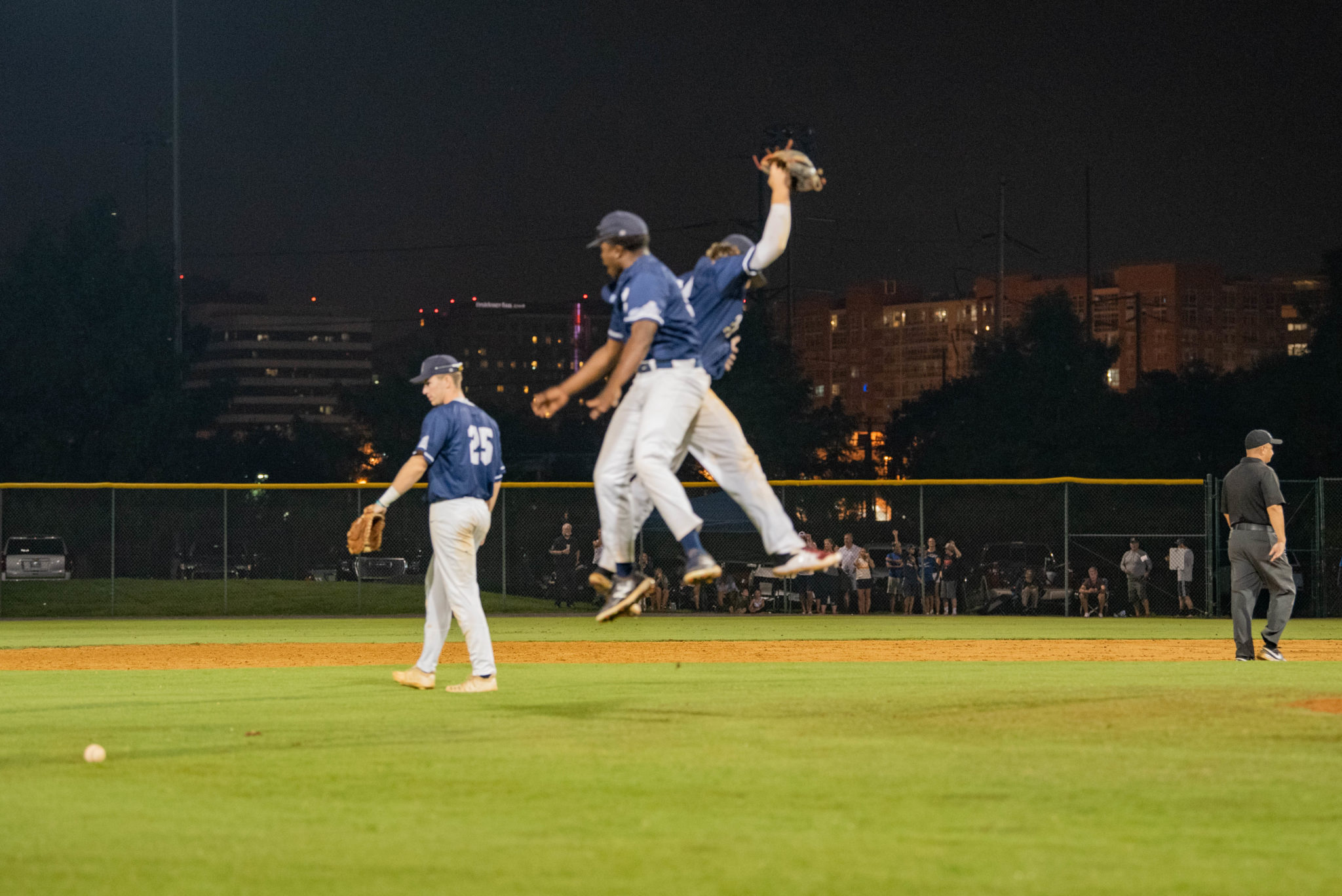 two aces players hip bump in the air 