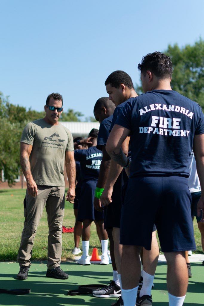 an alexandria fire department member looks on as recruits train in o2x program 2022