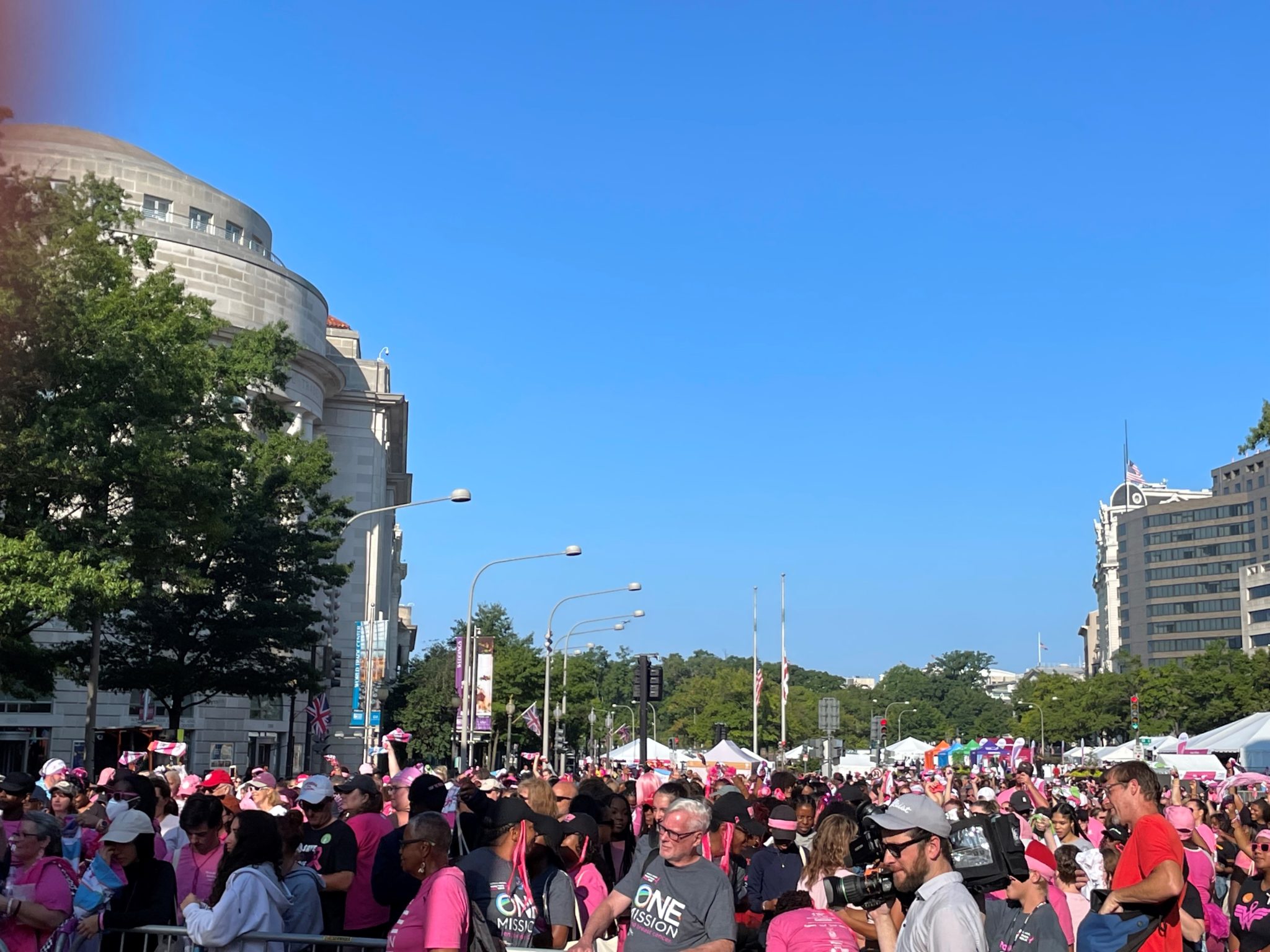 thousands of people wearing pink t shirts gathered in DC's Freedom Plaza for Susan G Komen Breast Cancer walk