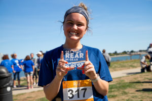 woman holding award