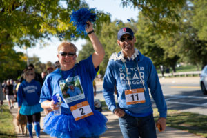 woman and man walking 5K race