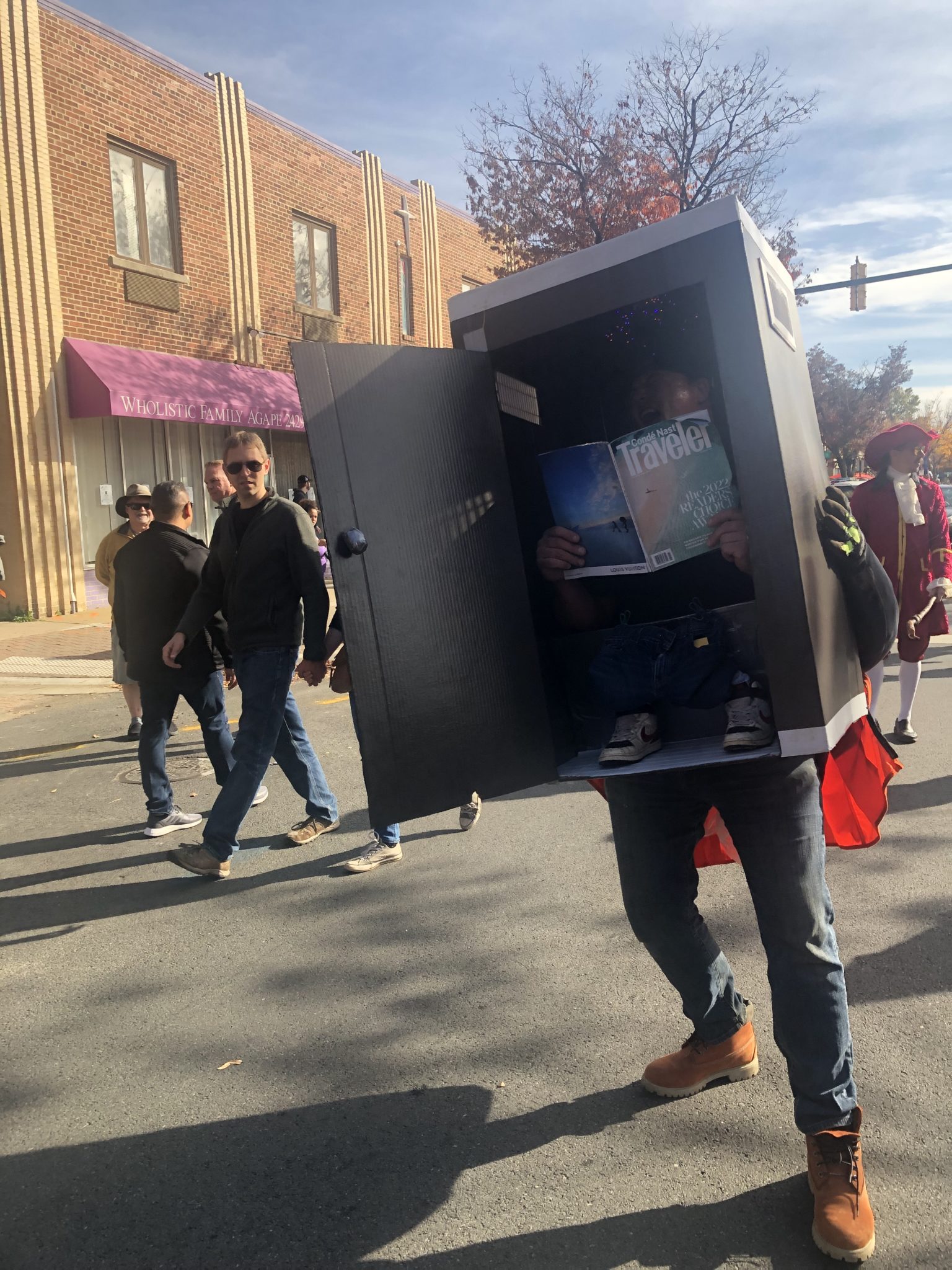 a man inside a port o potty costume