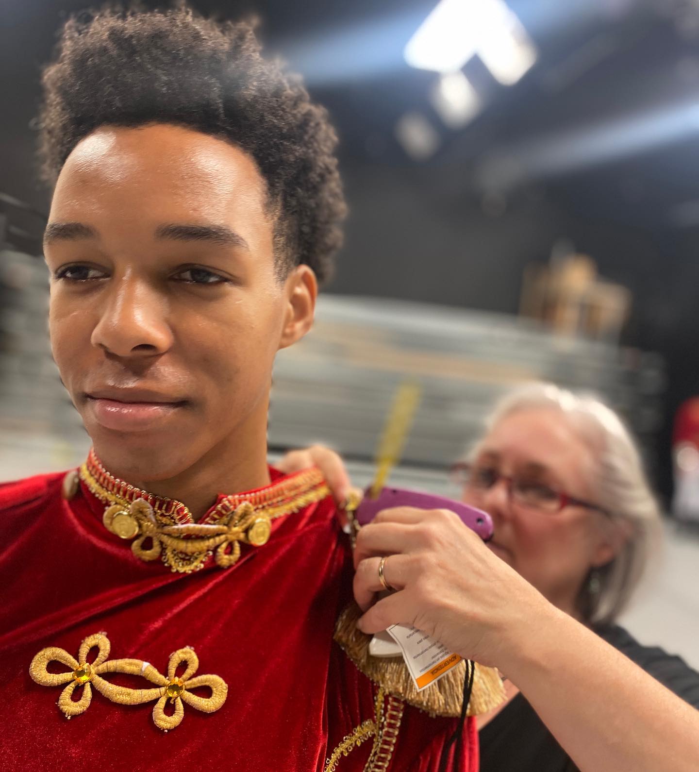 boy ballet dancer gets ready in nutcracker costume 