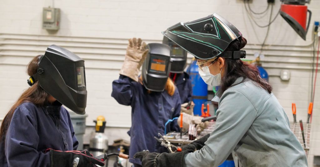 Girls learning welding