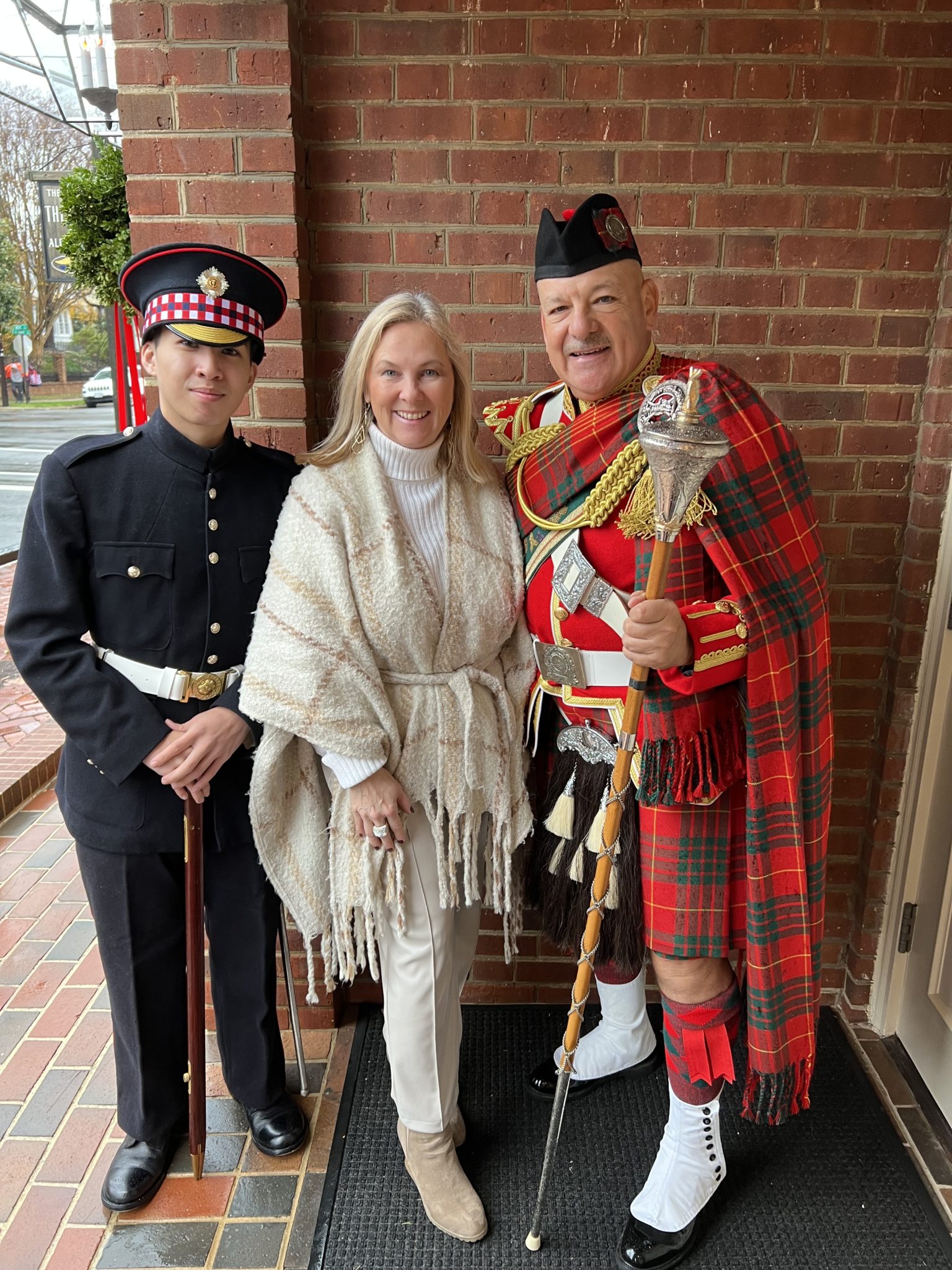 People posing with Scottish Kilts on