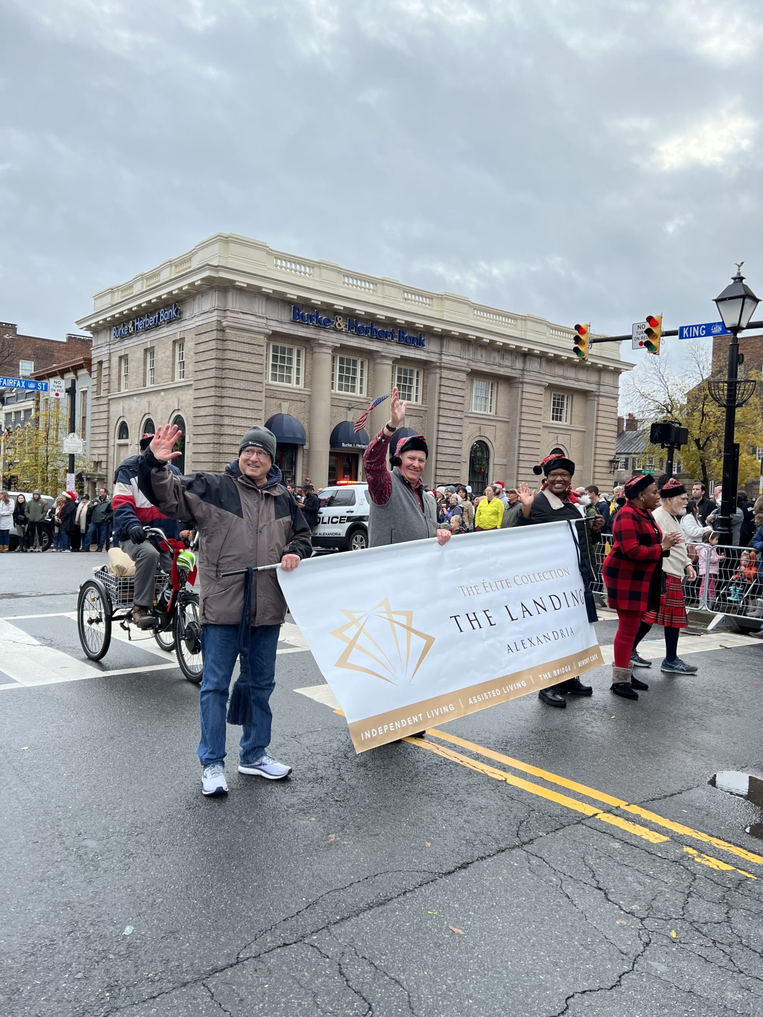 parade marchers holding banner