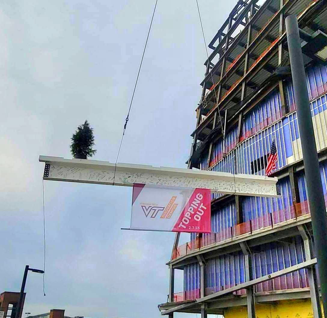 Community leaders and invited guests signed the final top beam of 11-story academic building of Virginia Tech Innovation Campus in Alexandria, VA. (Photo: Lucelle O'Flaherty)