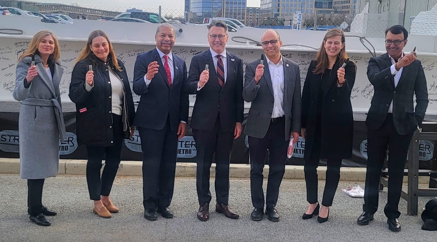 Leaders of Virginia Tech and the City of Alexandria celebrated the milestone moment by signing their names to the final structural beam of Virginia Tech's first academic building on its Innovation Campus in Alexandria, Virginia. (Photo: Lucelle O'Flaherty)