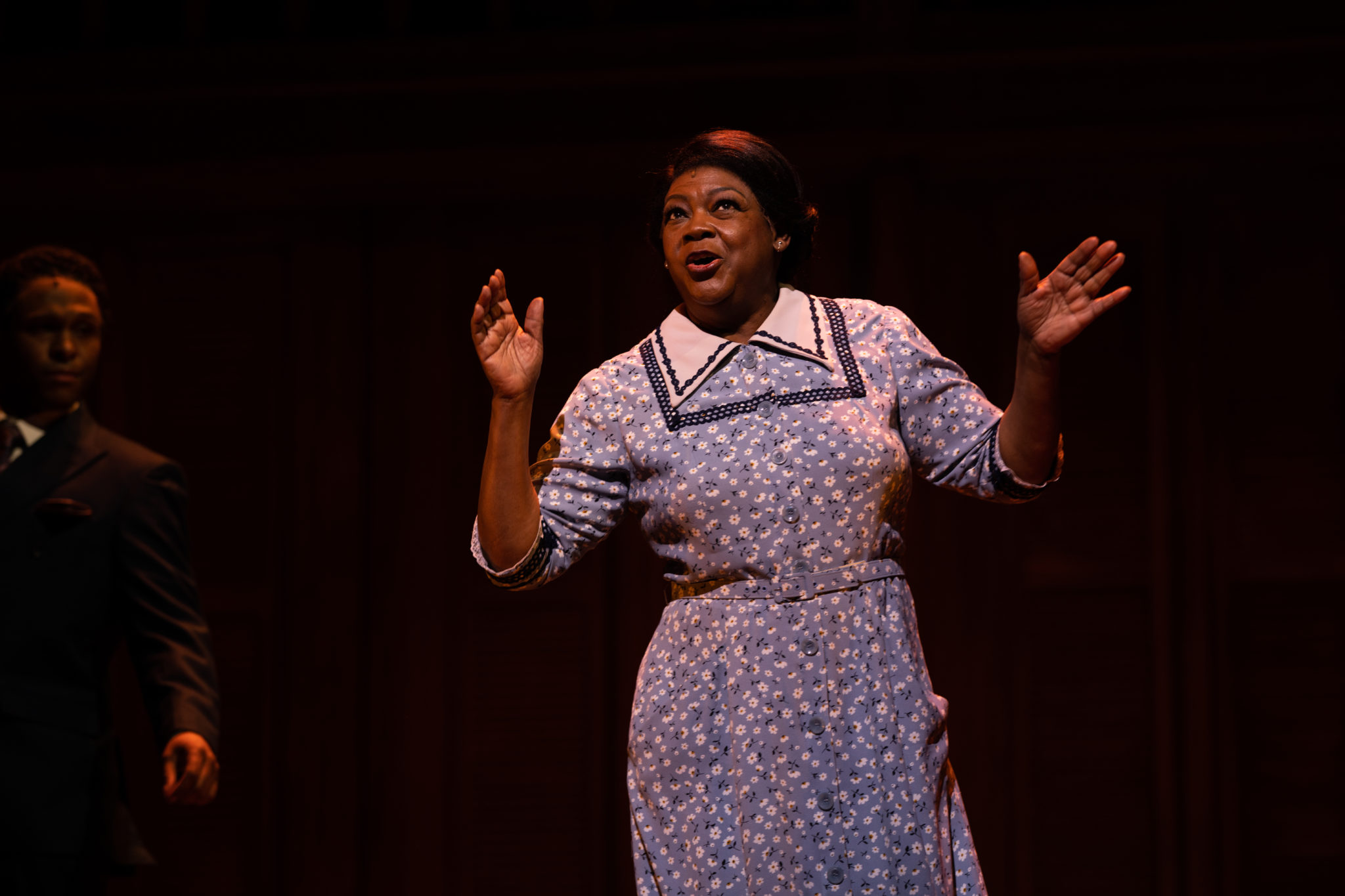 Carol Dennis as evangelist Katie Bell Nubin with (background) Jarran Muse in the musical “SHOUT SISTER SHOUT!” at Ford’s Theatre. Photo by André Chung.