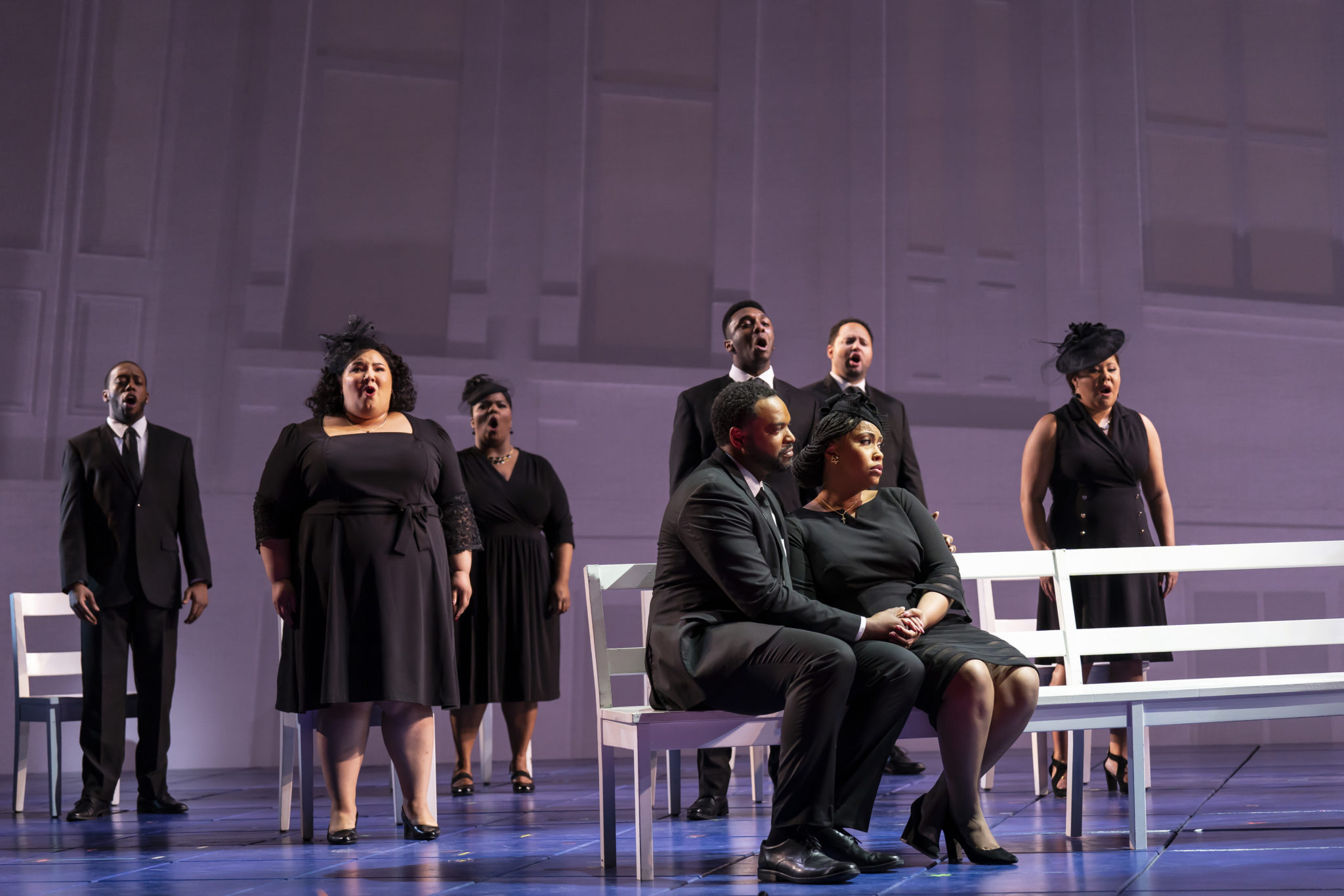 Bass Kenneth Kellogg (front, left) plays The Father; mezzo-soprano Briana Hunter (front, right) plays The Mother. (Photo: Scott Suchman)