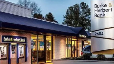 BANK atm MACHINES AND NAVY BLUE AWNING AND bURKE AND hERBERT SIGN