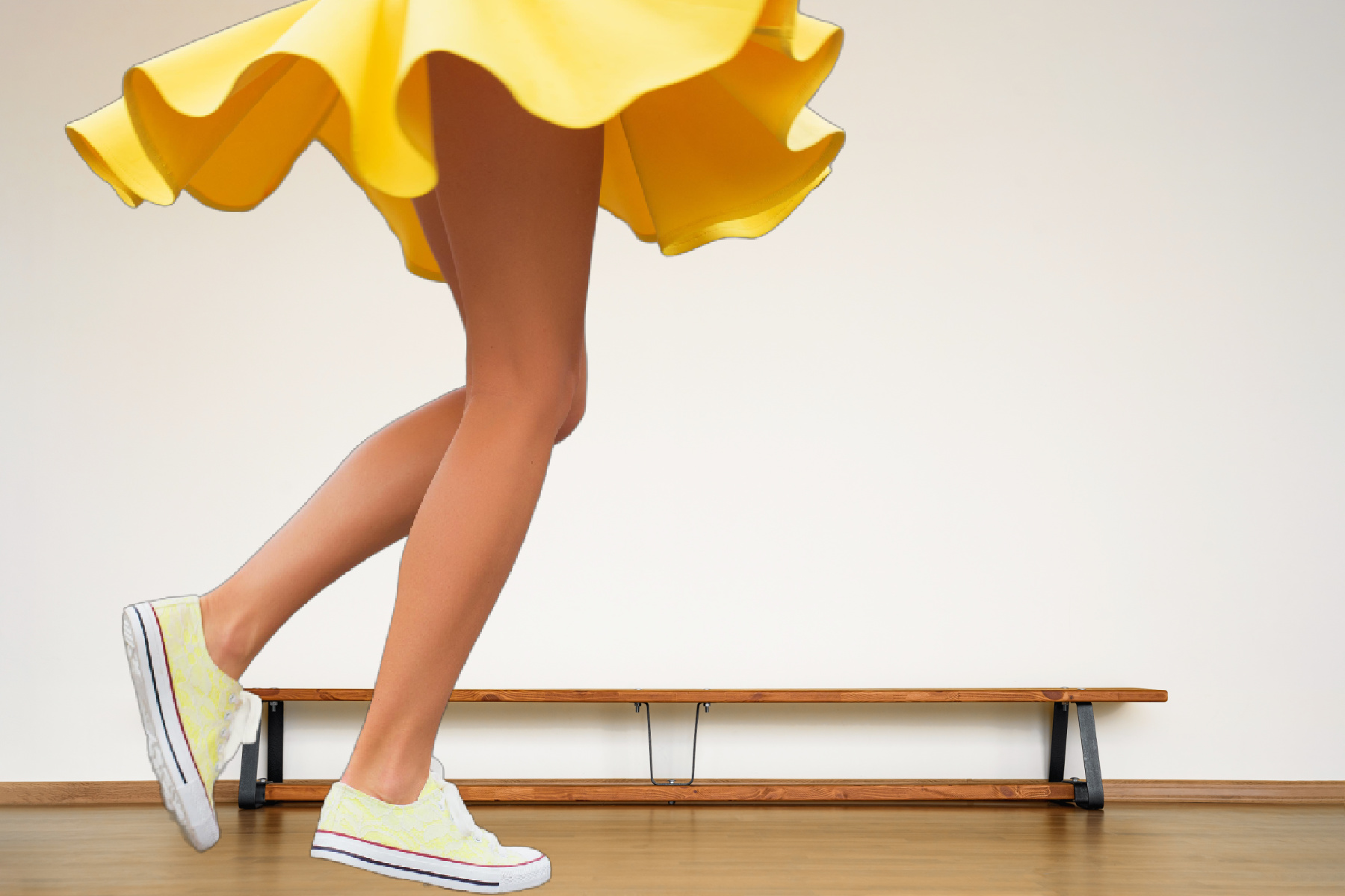 Girl in yellow dress wearing sneakers waist down only. (Istock photo licensed to The Zebra Press)