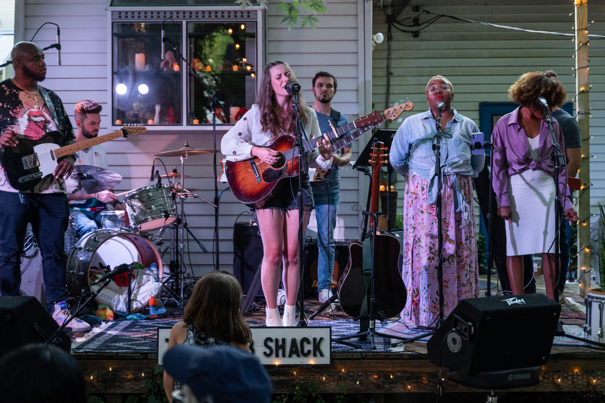 band playing on backyard stage