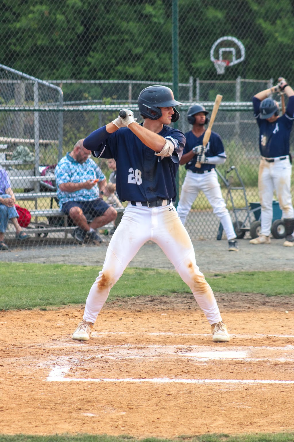 Young man waits for pitch with wooden bat in a baseball game. (Photo: Brian Cooney/The Zebra Press)