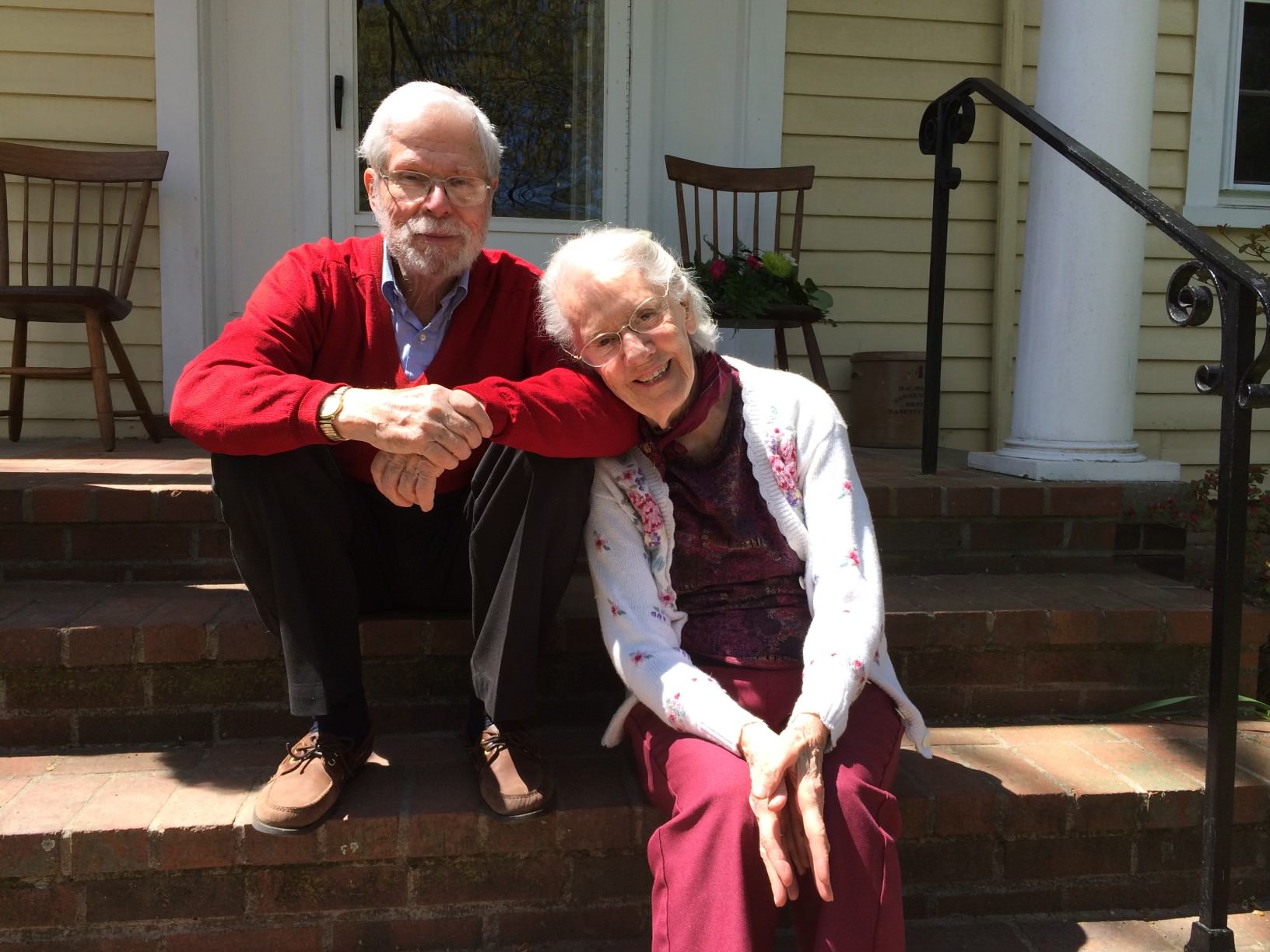 Elderly couple on steps.