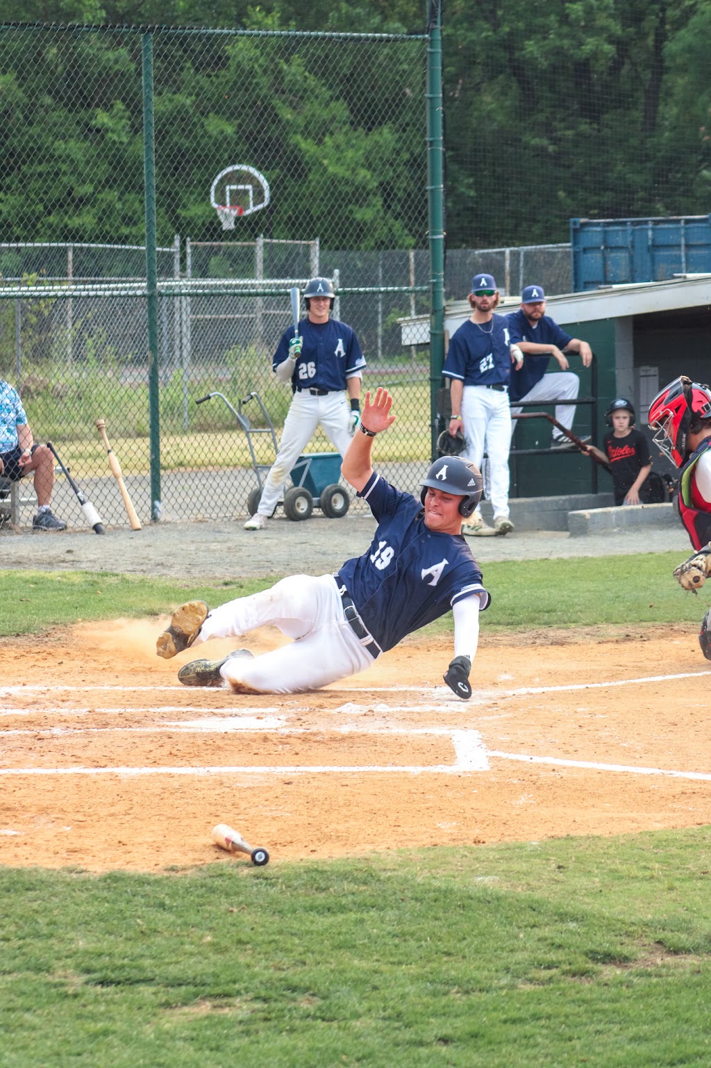 Baseball player sliding into home plate. (Photo: Brian Cooney/The Zebra Press, June 16, 2023)