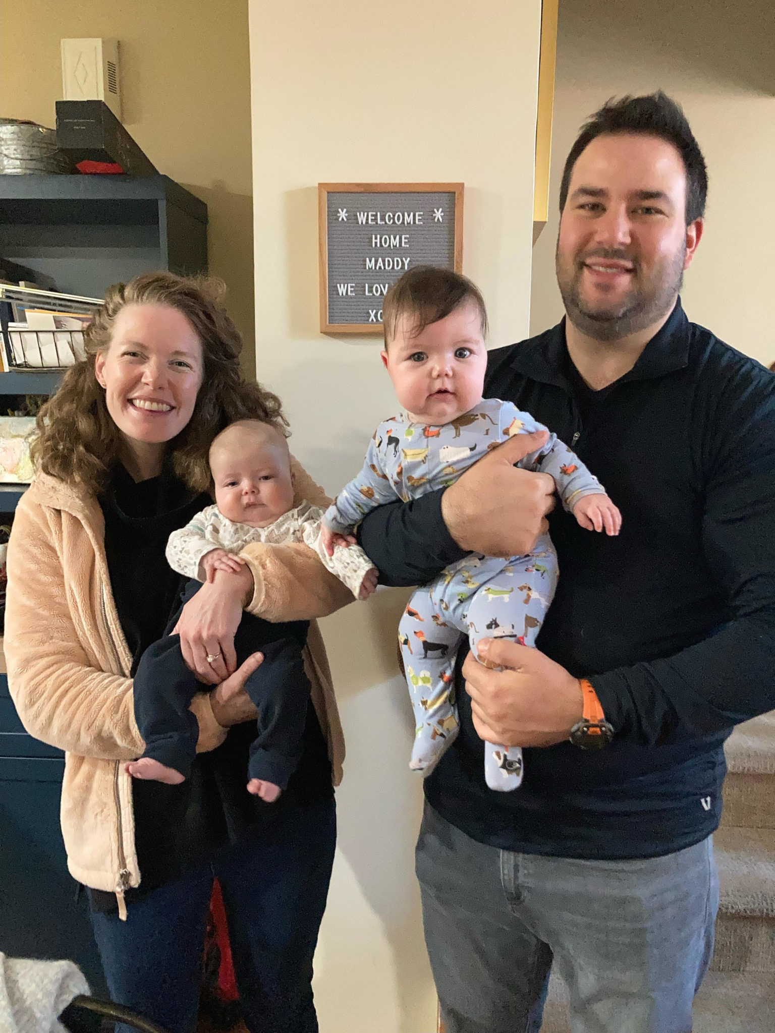 Lady and man holding twins