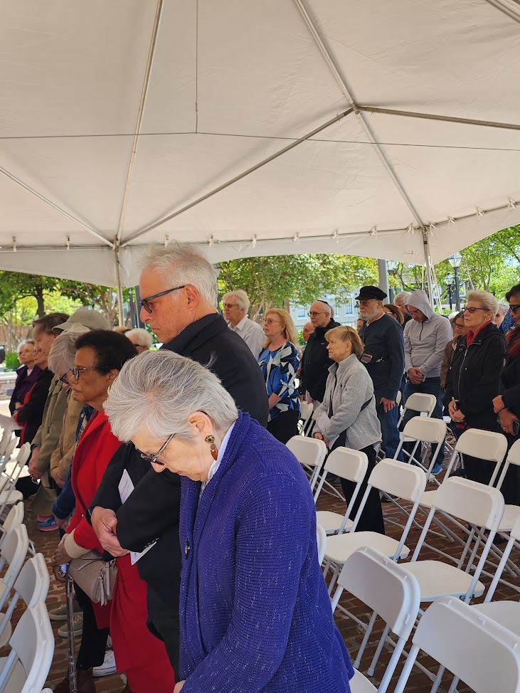 Alexandria Mayor Justin Wilson issues a proclamation, recognizing Joyce Gordon for her leadership on the Days of Remembrance Planning Committee. Gordon is stepping down. (Photo: Judith Fogel)