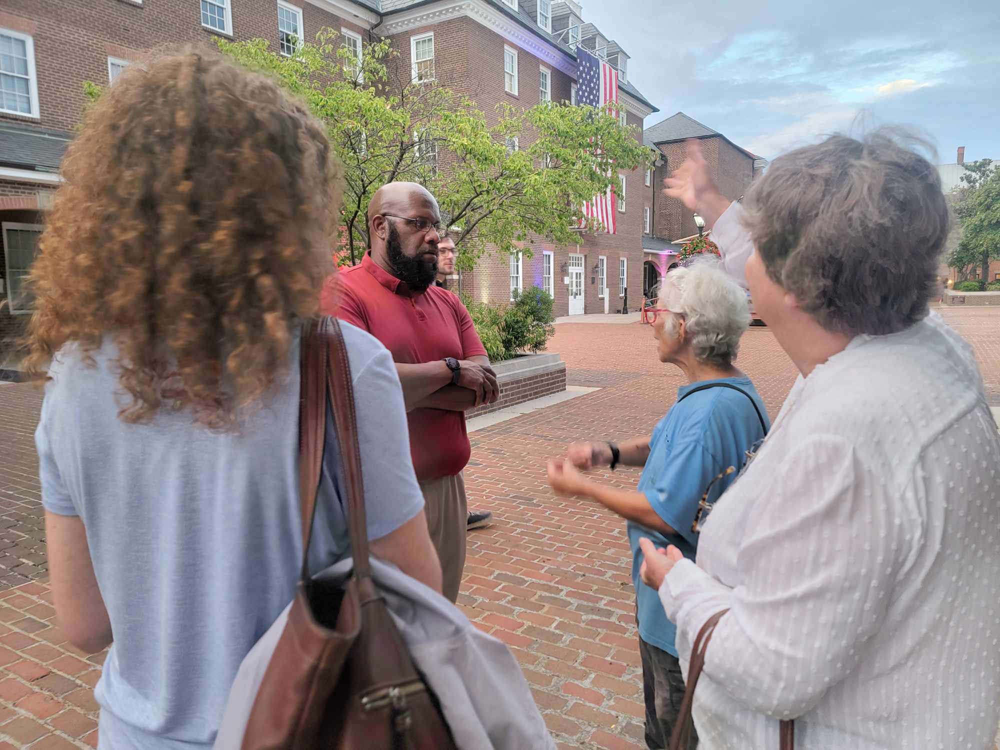 Alexandria Councilman John Chapman, speaking to (left to right) Erin Winograd, local activist and Alexandria Living Legend Carter Dudley Flemming, and Betty Guttmann (Photo Lucelle O’Flaherty) 