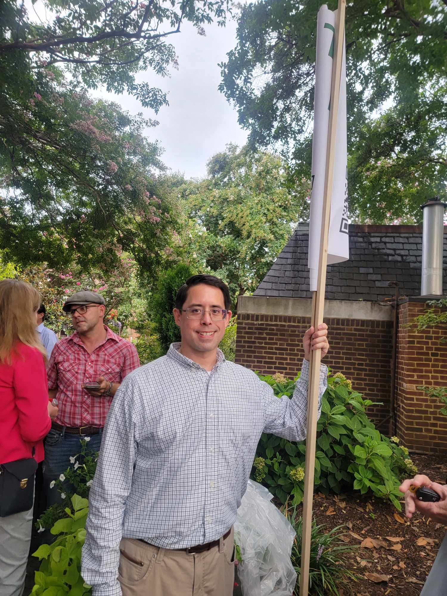 Coalition Treasurer Will Shen, who also spoke (Photo Lucelle O’Flaherty), former mayor Allison Silberberg on left behind Shen 