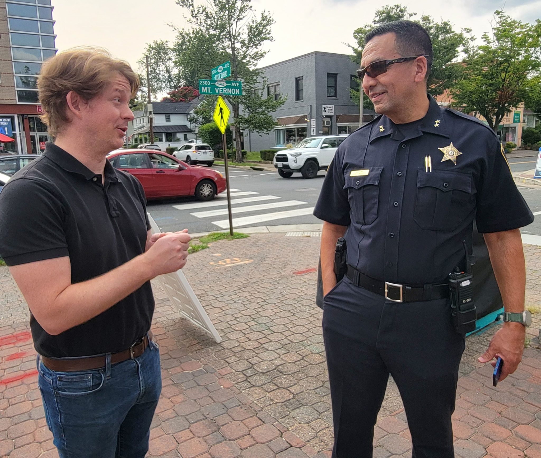 Police officer talking to a resident in Del Ray. (Photo: Lucelle O'Flaherty)