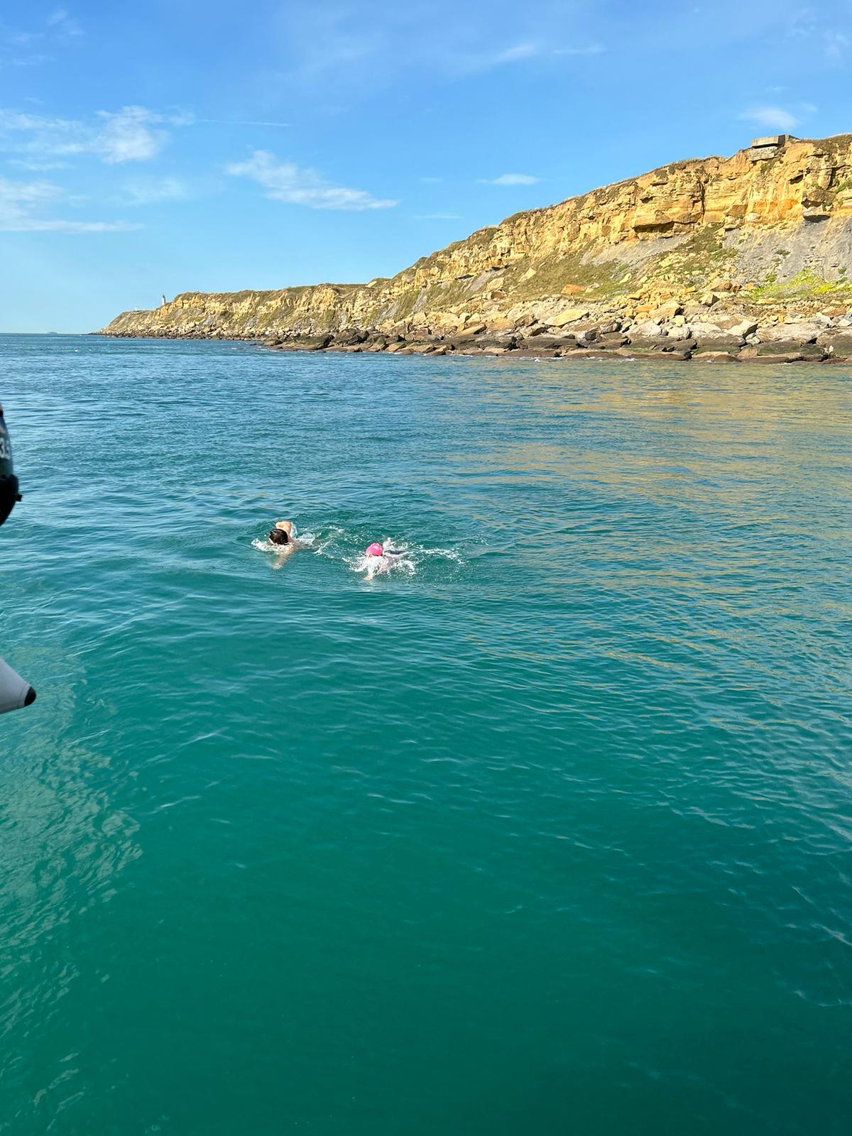 Man swimming in beautiful water in English Channel near France.