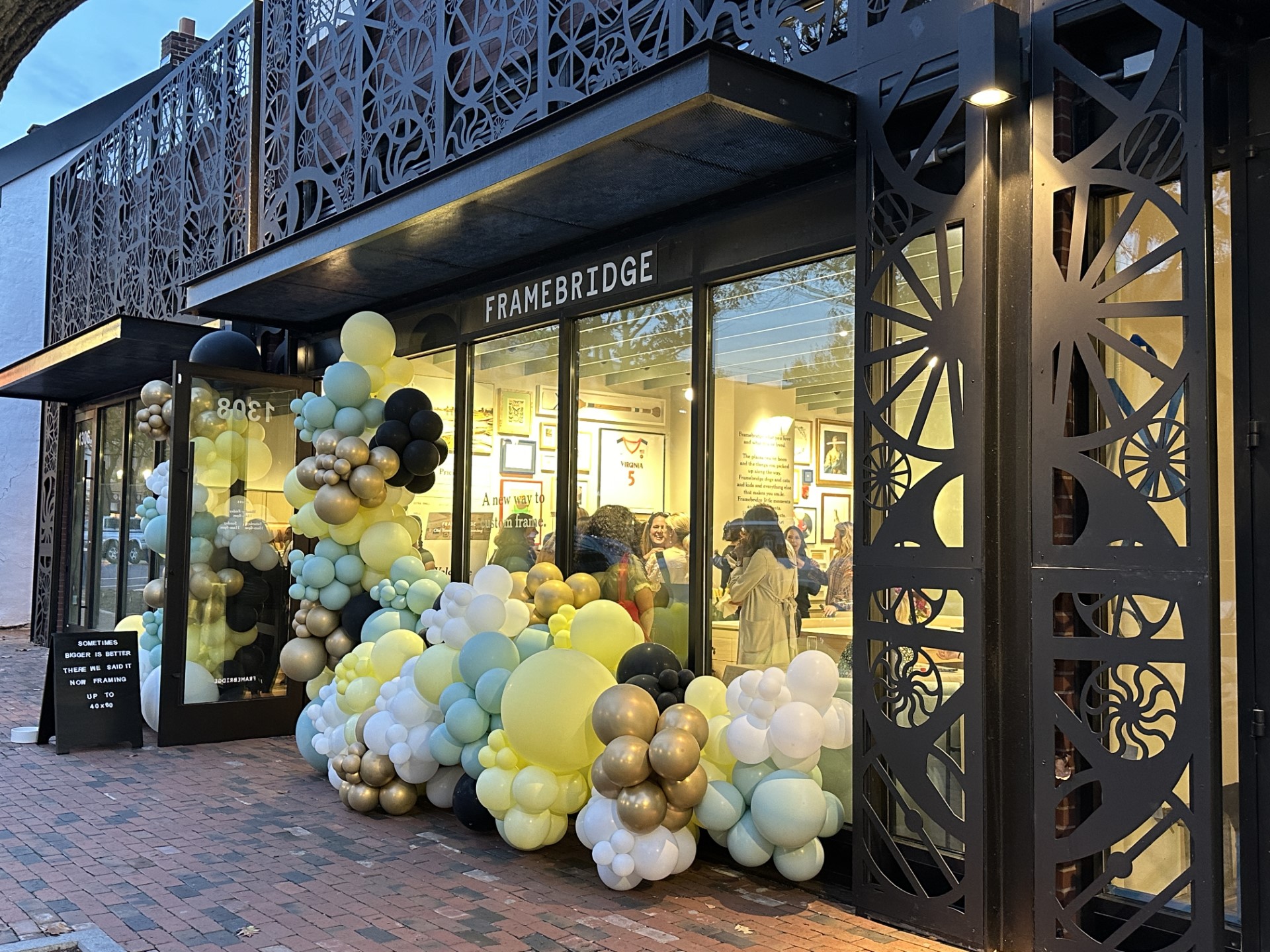 OUtside of Framebridge store with balloons.