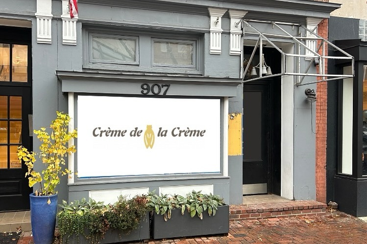 Gray Storefront that says Creme de la Creme and has the number 907 in gold.