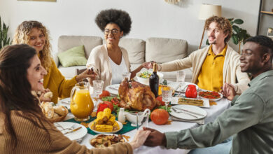 People gathered around a Thanksgiving table--diverse representation.