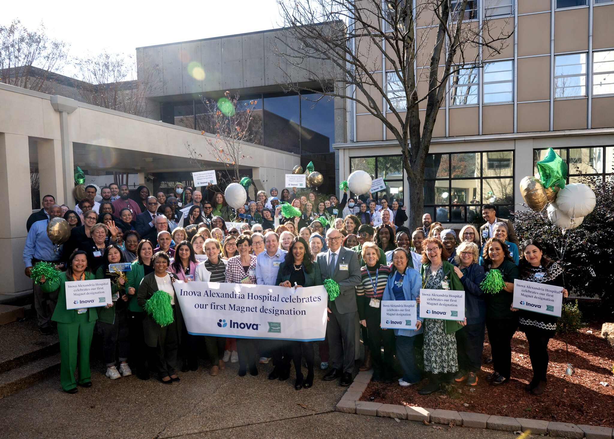 Staff gathers in front of Inova Alexandria Hospital for group photo.