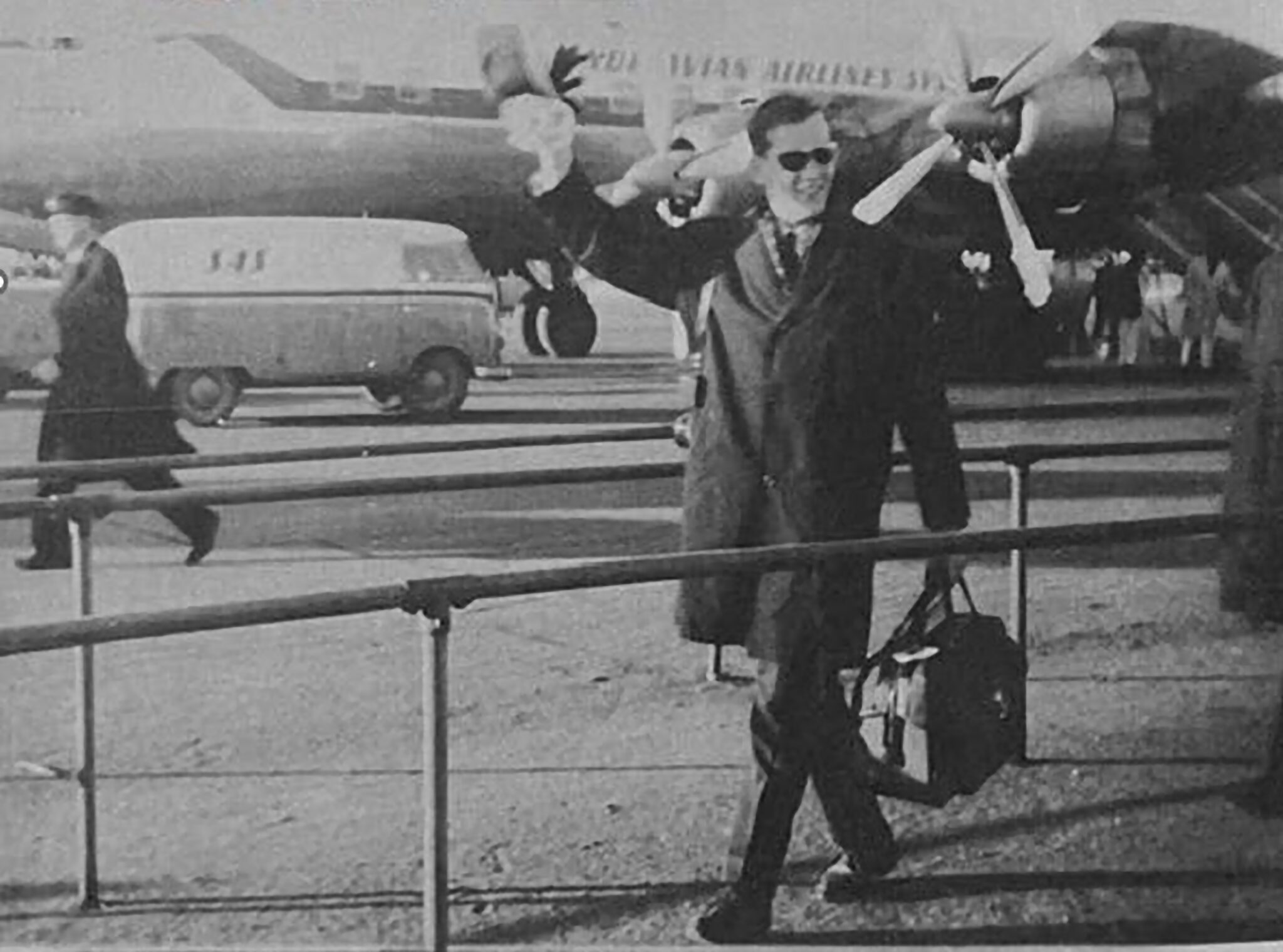 Black and white photo of EIvind Bjerke with planes in background used on cover.