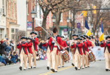 Colonial reanactors marching in parade