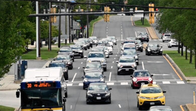 many cars stuck in traffic at a light on Duke Street in Alexandria va