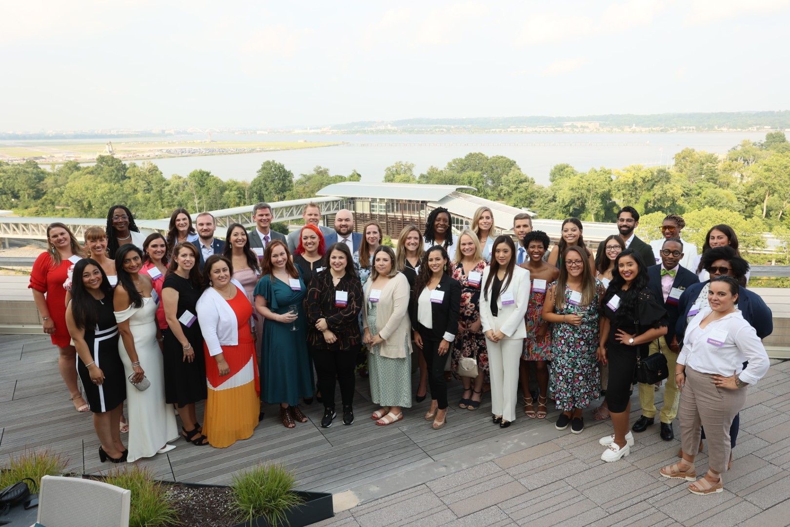 large group of young professionals posing together